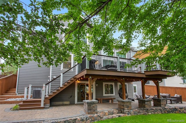 7027 Chestnut Hill St, Highlands Ranch, CO 80130 - back of house with stairway, a deck, an outdoor hangout area, and a patio