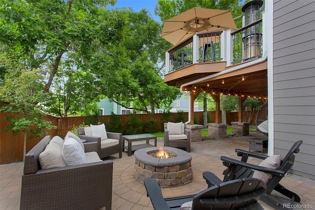 7027 Chestnut Hill St, Highlands Ranch, CO 80130 - fenced backyard featuring a patio and an outdoor living space with a fire pit