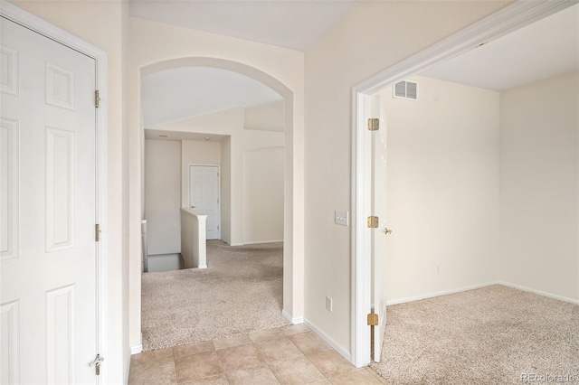 corridor with light carpet