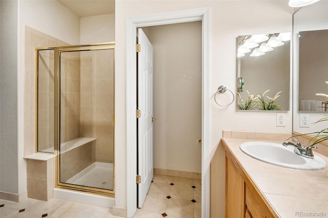 bathroom with tile patterned flooring, vanity, and an enclosed shower