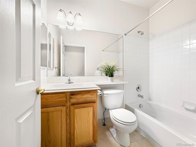 full bathroom with vanity, tiled shower / bath, tile patterned floors, and toilet