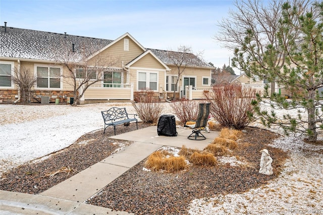 rear view of house with a patio