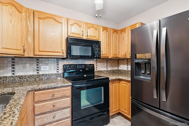 585 S Alton Way Unit 4D, Denver, CO 80247 - kitchen featuring black appliances, tasteful backsplash, light brown cabinetry, and light stone counters