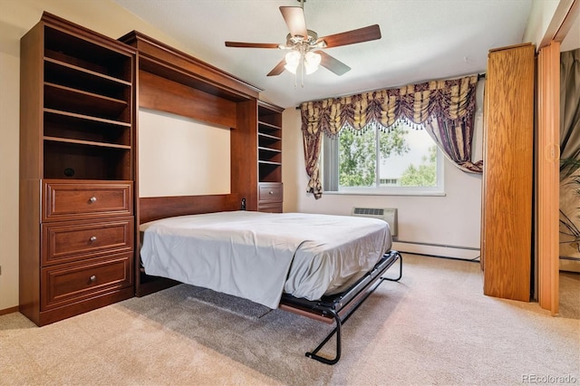 585 S Alton Way Unit 4D, Denver, CO 80247 - bedroom featuring a baseboard heating unit, carpet floors, a wall mounted AC, and ceiling fan
