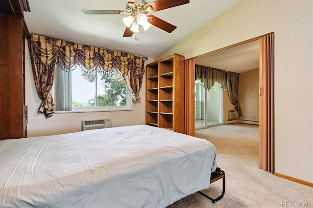 585 S Alton Way Unit 4D, Denver, CO 80247 - bedroom featuring carpet flooring, an AC wall unit, a baseboard heating unit, lofted ceiling, and a ceiling fan