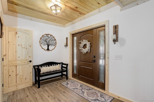 28251 Shadow Mountain Dr, Conifer, CO 80433 - foyer featuring wooden ceiling, light wood-style flooring, and baseboards