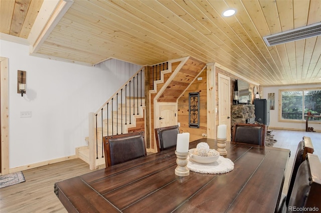 28251 Shadow Mountain Dr, Conifer, CO 80433 - dining room featuring wood ceiling, stairway, wood finished floors, lofted ceiling, and baseboards