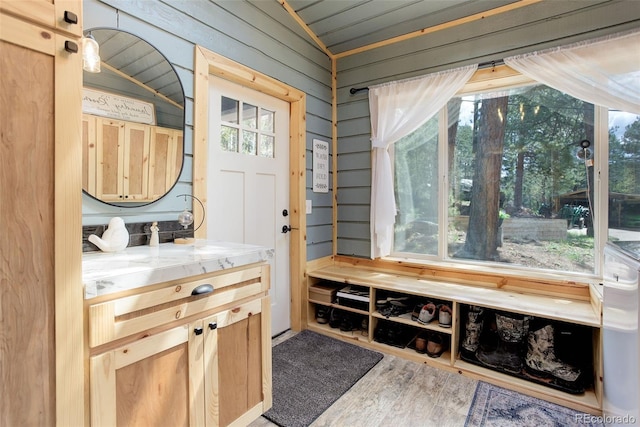 28251 Shadow Mountain Dr, Conifer, CO 80433 - mudroom with wood finished floors, lofted ceiling, and wood walls