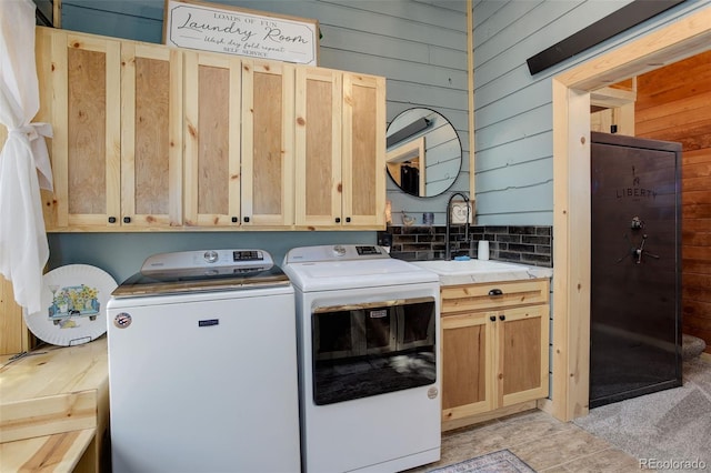 28251 Shadow Mountain Dr, Conifer, CO 80433 - laundry room with wood walls, cabinet space, and independent washer and dryer