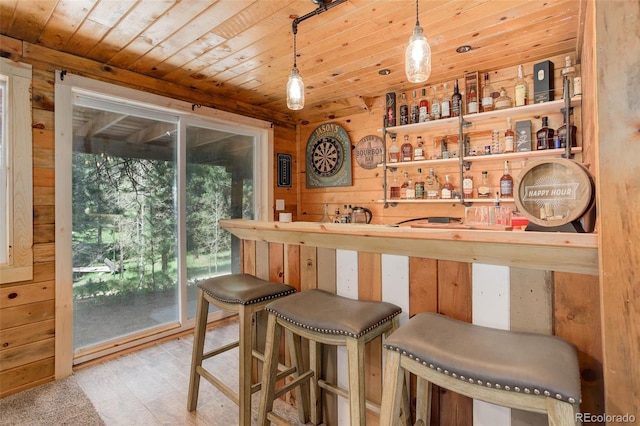 28251 Shadow Mountain Dr, Conifer, CO 80433 - indoor bar with wooden ceiling, wood walls, wood finished floors, and pendant lighting