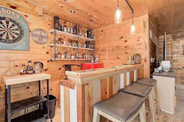 28251 Shadow Mountain Dr, Conifer, CO 80433 - indoor wet bar featuring wooden ceiling, wooden walls, and decorative light fixtures