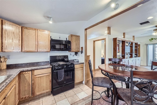 195 Briggs St, Erie, CO 80516 - kitchen featuring black appliances, ceiling fan, lofted ceiling, light tile patterned flooring, and a textured ceiling