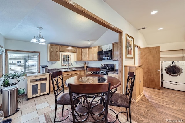 195 Briggs St, Erie, CO 80516 - dining area with visible vents, vaulted ceiling, washer / dryer, recessed lighting, and a notable chandelier