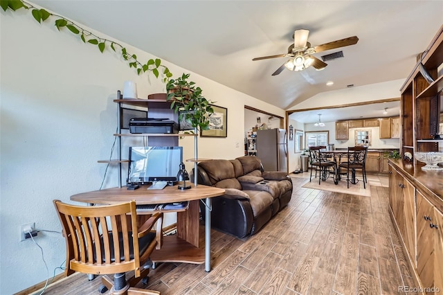 195 Briggs St, Erie, CO 80516 - living area with light wood finished floors, ceiling fan, and lofted ceiling