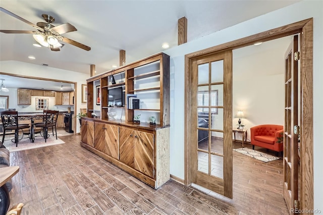 195 Briggs St, Erie, CO 80516 - kitchen featuring visible vents, ceiling fan, lofted ceiling, and wood finish floors