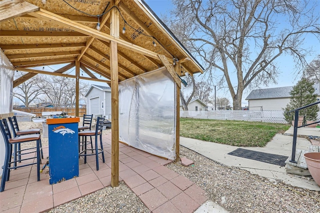 195 Briggs St, Erie, CO 80516 - view of patio / terrace with outdoor dry bar, a storage shed, fence private yard, and an outbuilding