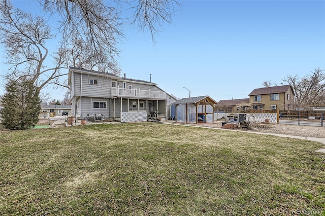 195 Briggs St, Erie, CO 80516 - back of house featuring a lawn, an outdoor structure, and fence