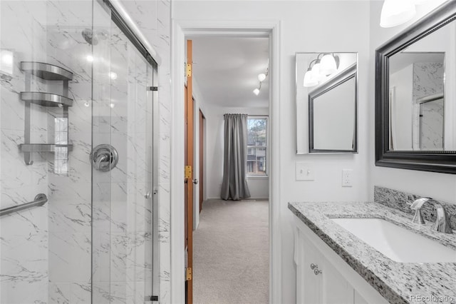 7068 E Briarwood Dr, Centennial, CO 80112 - full bathroom featuring a marble finish shower and vanity
