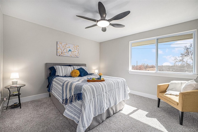 carpeted bedroom featuring ceiling fan and baseboards