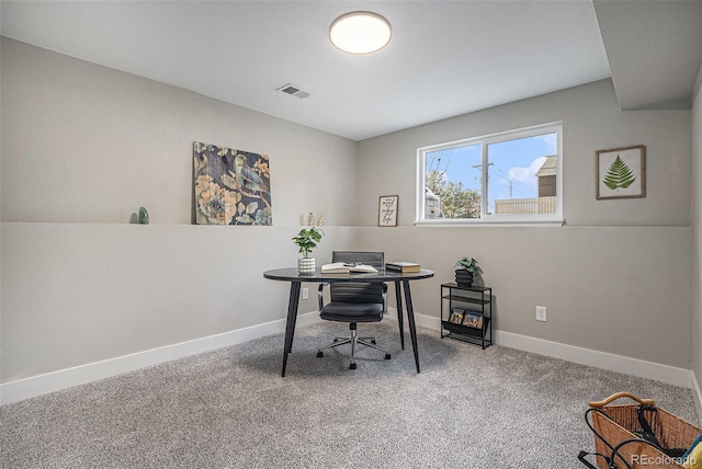 carpeted home office with baseboards and visible vents