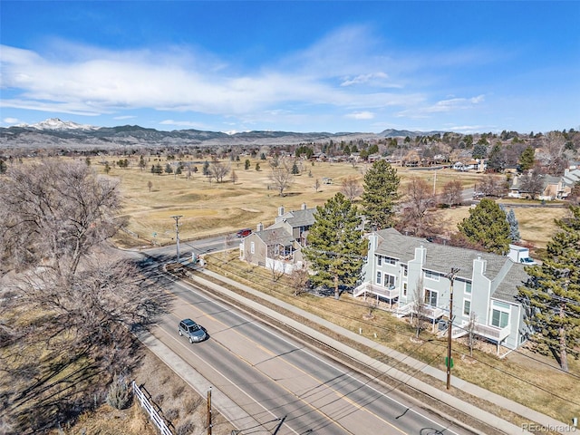 birds eye view of property featuring a mountain view