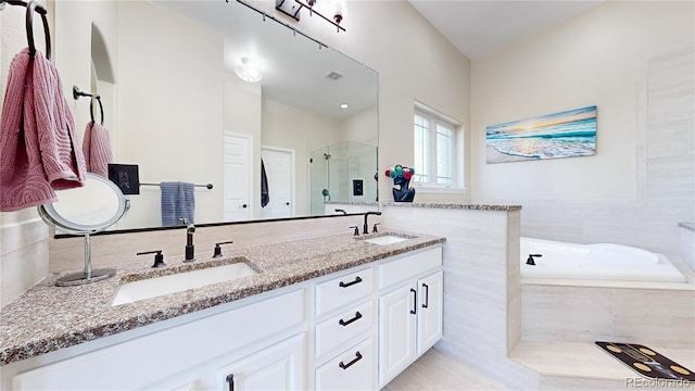 9353 E 146th Ave, Brighton, CO 80602 - full bathroom with a stall shower, double vanity, and a garden tub