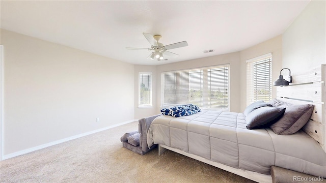 9353 E 146th Ave, Brighton, CO 80602 - carpeted bedroom featuring multiple windows and a ceiling fan