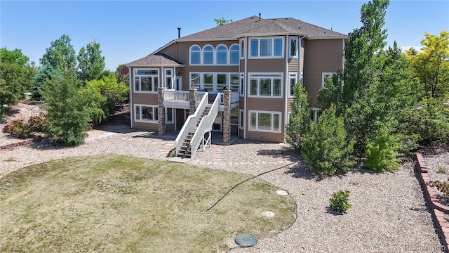 9353 E 146th Ave, Brighton, CO 80602 - rear view of property with stairs, a deck, a yard, and roof with shingles