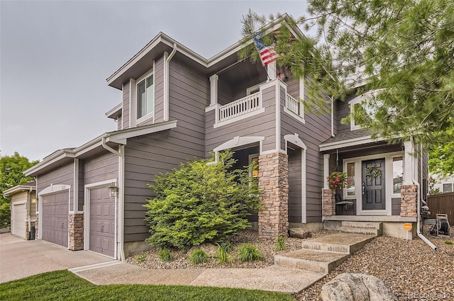 10230 Lauren Ct, Highlands Ranch, CO 80130 - view of side of property featuring a balcony, a garage, concrete driveway, and stone siding