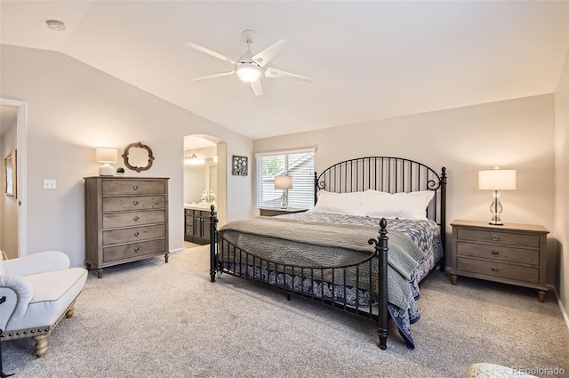 10230 Lauren Ct, Highlands Ranch, CO 80130 - carpeted bedroom with vaulted ceiling, arched walkways, ensuite bath, and ceiling fan