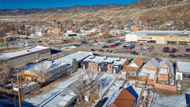 birds eye view of property with a mountain view