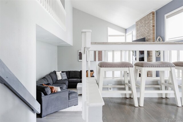 6386 S Pierson St, Littleton, CO 80127 - living room featuring wood finished floors and high vaulted ceiling