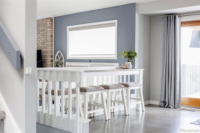 6386 S Pierson St, Littleton, CO 80127 - dining space featuring plenty of natural light and baseboards