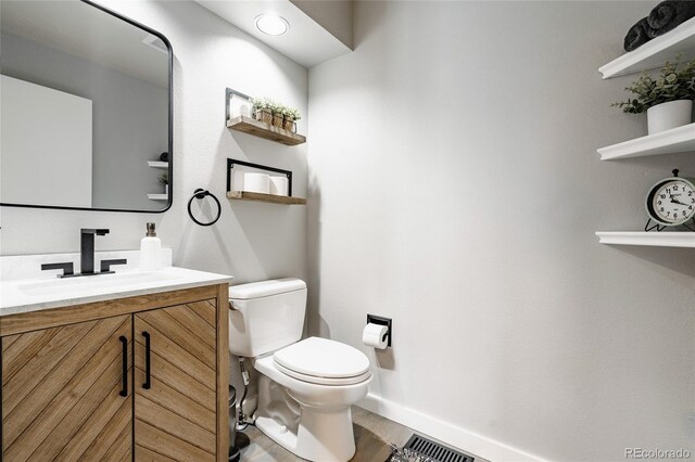 6386 S Pierson St, Littleton, CO 80127 - bathroom with vanity, baseboards, toilet, and wood finished floors