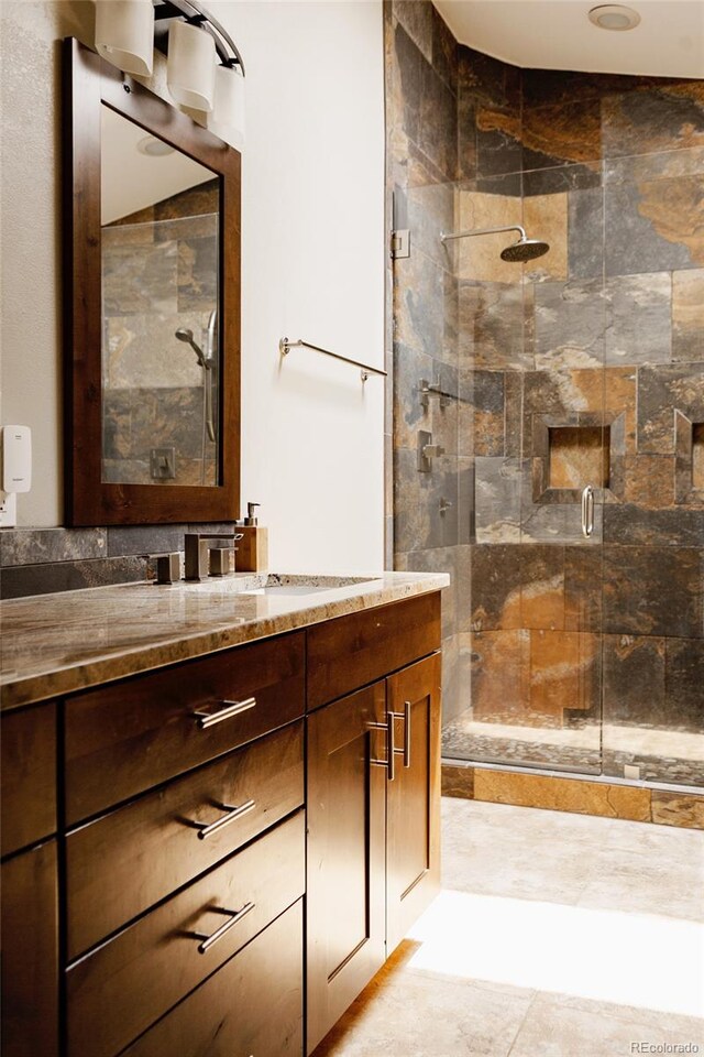 6386 S Pierson St, Littleton, CO 80127 - bathroom featuring a shower stall and vanity