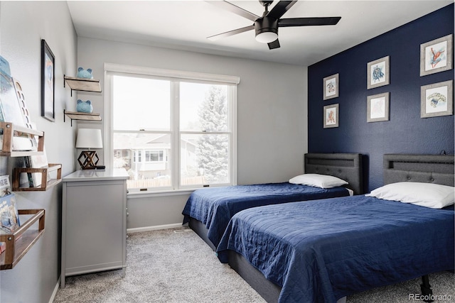 6386 S Pierson St, Littleton, CO 80127 - bedroom featuring multiple windows, light colored carpet, baseboards, and a ceiling fan