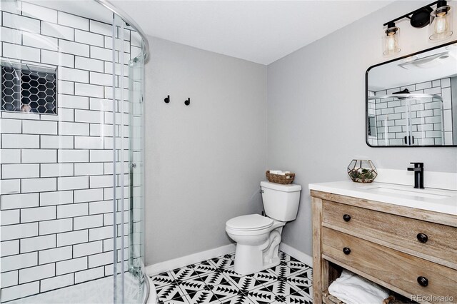 6386 S Pierson St, Littleton, CO 80127 - bathroom with a stall shower, toilet, baseboards, and vanity