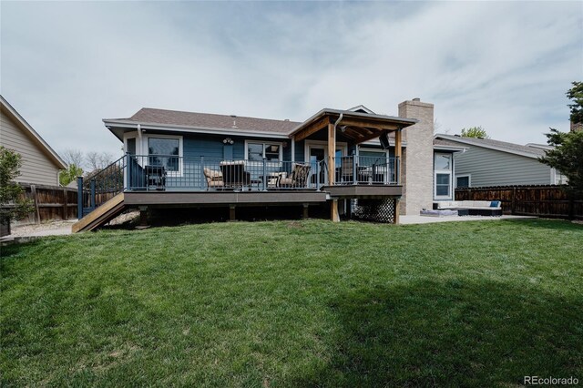 6386 S Pierson St, Littleton, CO 80127 - rear view of house featuring a wooden deck, a chimney, and stairway