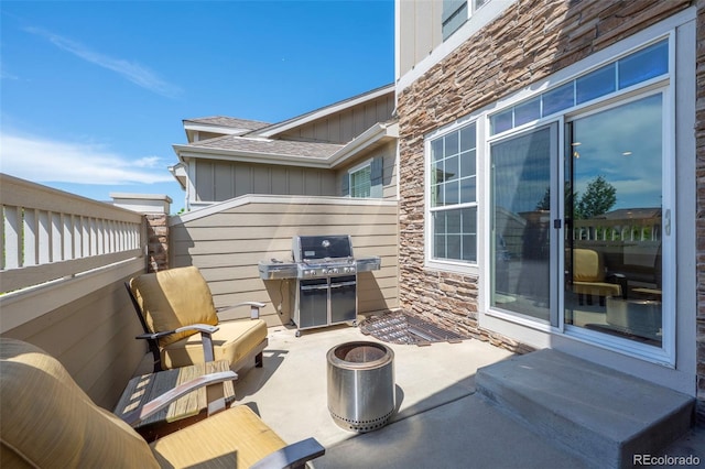 4887 Raven Run, Broomfield, CO 80023 - view of patio / terrace featuring a fire pit and a grill