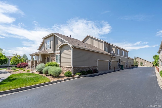 4887 Raven Run, Broomfield, CO 80023 - view of side of property featuring stone siding