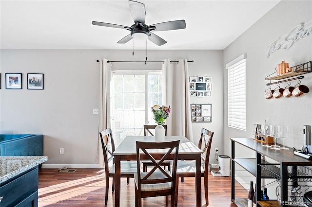 dining room featuring hardwood / wood-style flooring and ceiling fan