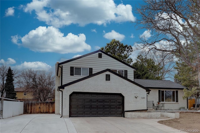 view of front facade with fence, an attached garage, a shingled roof, concrete driveway, and brick siding