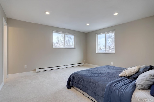 carpeted bedroom featuring recessed lighting, a baseboard radiator, and multiple windows