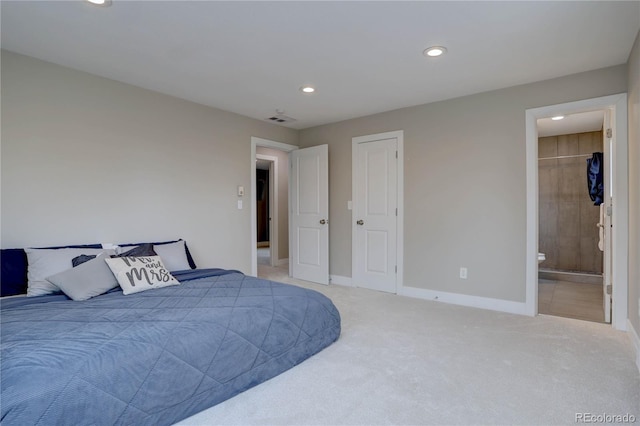 bedroom featuring baseboards, visible vents, recessed lighting, light carpet, and connected bathroom