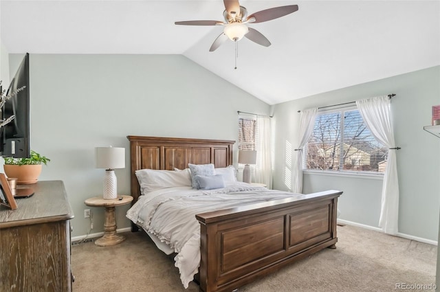 bedroom featuring lofted ceiling, light carpet, and ceiling fan