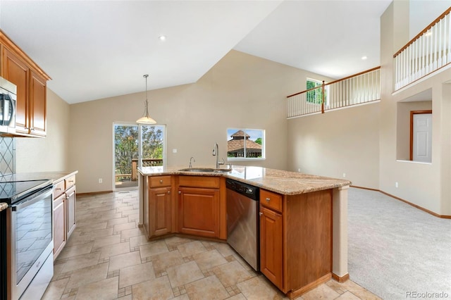 11335 W 54th Ln, Arvada, CO 80002 - kitchen with appliances with stainless steel finishes, a sink, a kitchen island with sink, brown cabinetry, and high vaulted ceiling