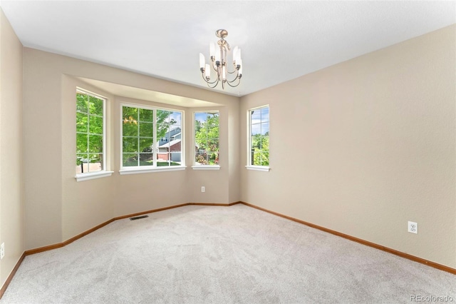 11335 W 54th Ln, Arvada, CO 80002 - carpeted spare room featuring a chandelier and baseboards