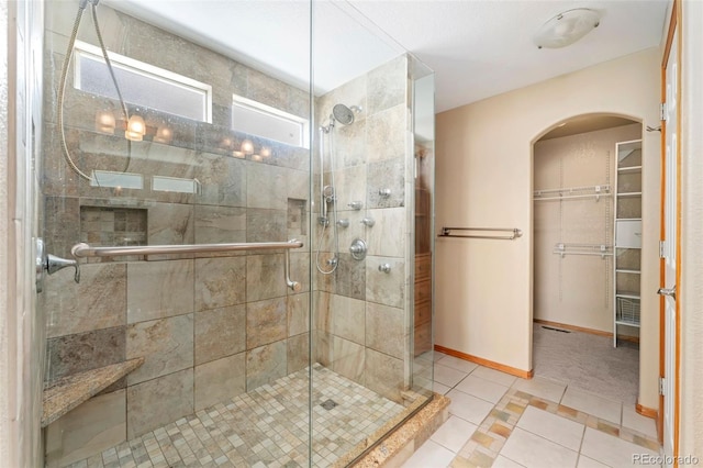11335 W 54th Ln, Arvada, CO 80002 - full bathroom with tile patterned flooring, a stall shower, and a spacious closet