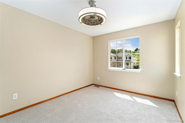 11335 W 54th Ln, Arvada, CO 80002 - unfurnished room with baseboards and carpet flooring