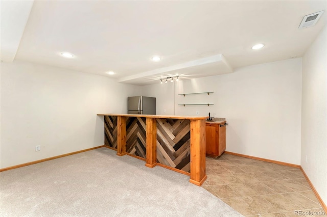 11335 W 54th Ln, Arvada, CO 80002 - finished below grade area featuring freestanding refrigerator, wet bar, recessed lighting, baseboards, and light carpet
